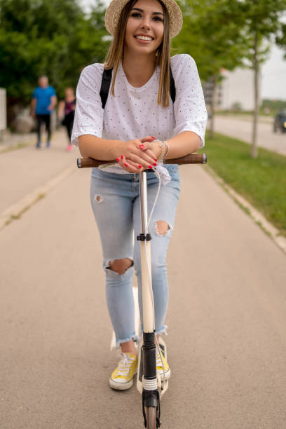 istock Woman riding scooter 1278618488