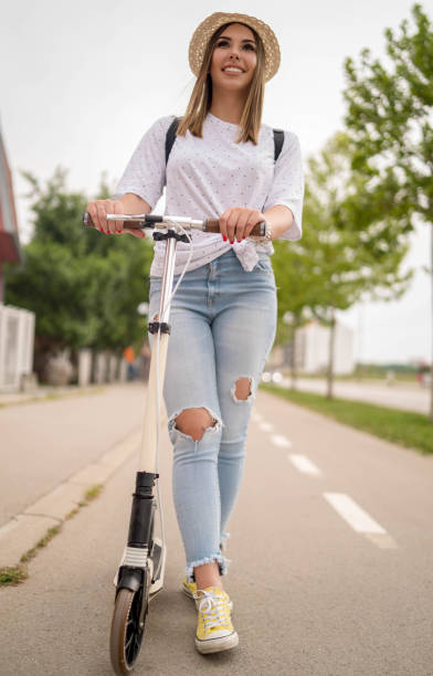 istock Woman riding scooter 1278618523