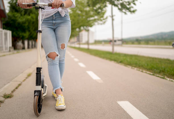 istock Woman riding scooter 1278618537