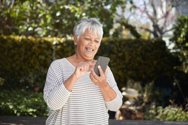 istock Happy senior woman using cellphone 1278618690