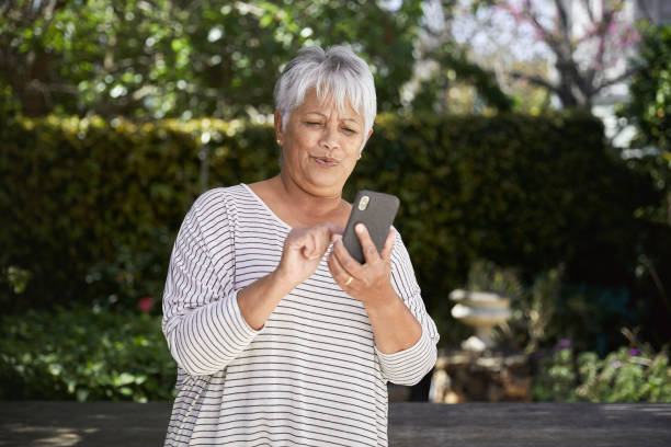istock Impressed senior woman using cellphone 1278618697