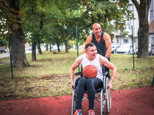 istock Disabled men playing basketball with friends 1278619583