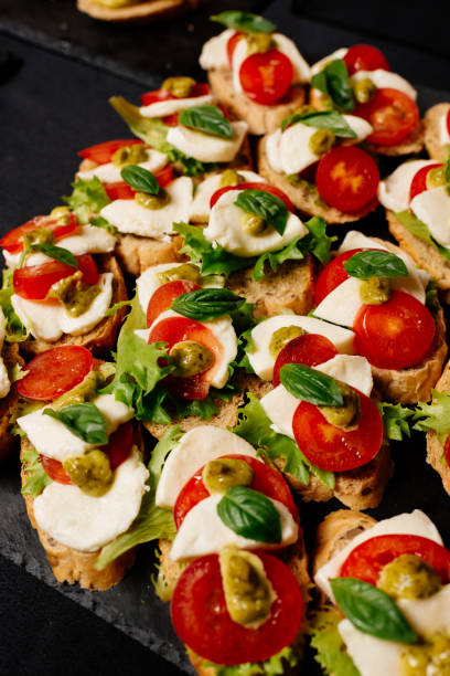 istock Close-up tasty bruschetta on black table 1278619736