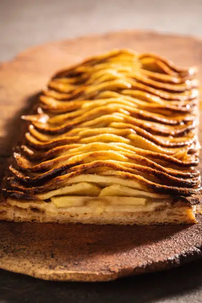 Apple puff pastry pie sliced cross section cut selective focus of foreground