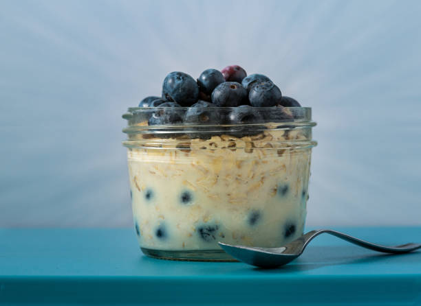 istock Overnight oats with fruit against blue background 1278620189