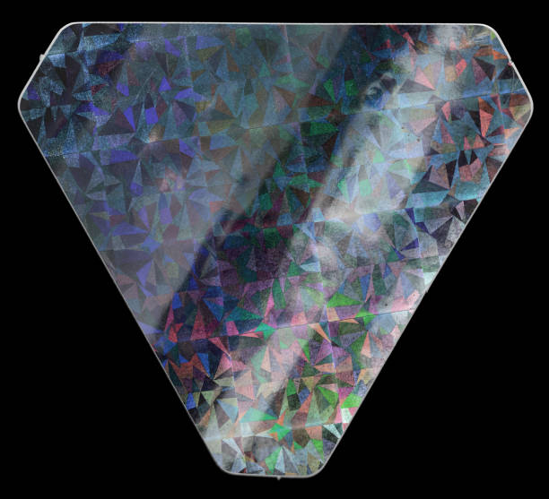 istock Shiny triangular sticker. Cool metallic holographic sticky tape shape isolated on black background. 1278621635