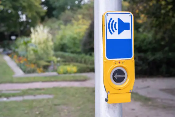 Button to cross at a crosswalk