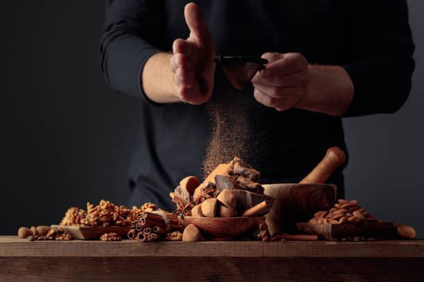 istock The cook sprinkles the chocolates with cocoa powder. 1278622679