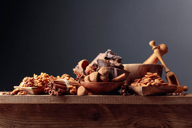 istock Various chocolates with ingredients on an old wooden table. 1278622906