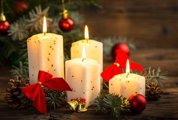 Christmas decoration with candles on the wooden table Christmas decoration with candles on the wooden table christmas decore candle stock pictures, royalty-free photos & images