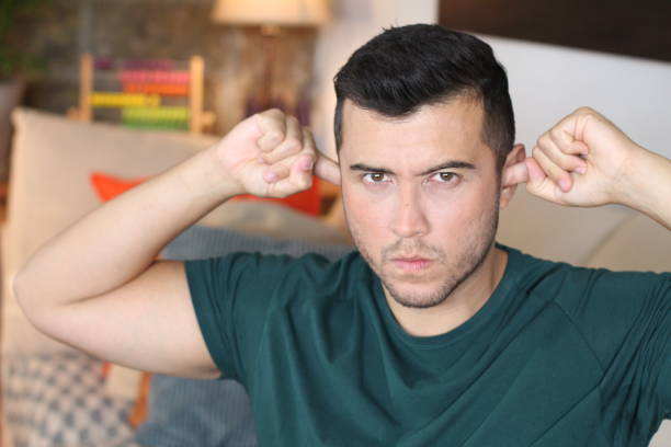 istock Stubborn young man blocking ears with fingers 1278626662