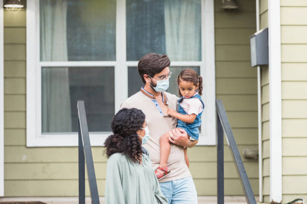 istock Mother and father focus attention on daughter 1278631644
