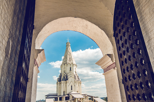 White Church Tower Seen Through Gate Entrance In Moscow, Russia