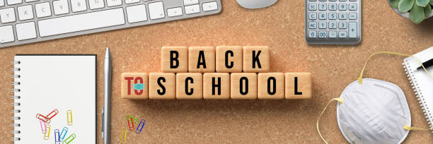 istock message BACK TO SCHOOL on cubes with utensils 1278632207