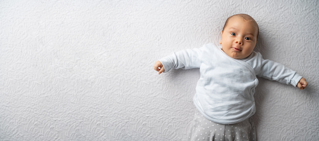 newborn baby boy on a white blanket