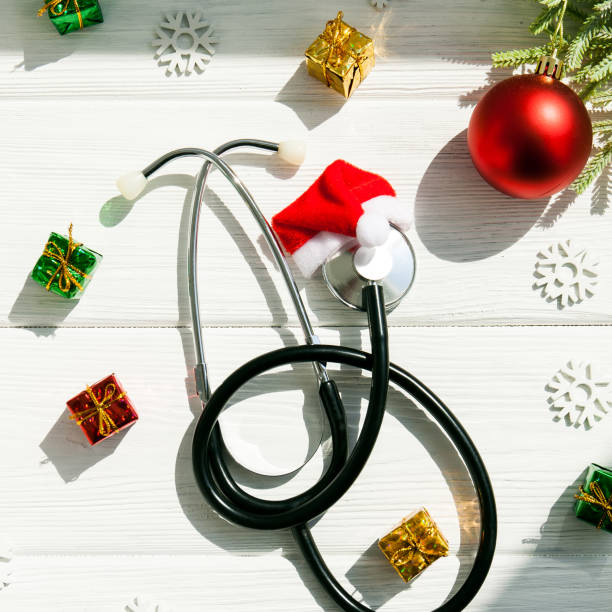 istock Stethoscope and Christmas decorations on wooden table. 1278636145