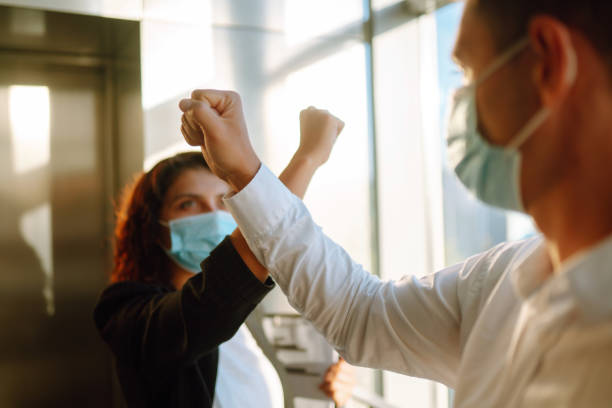 istock Elbow greeting to avoid the spread of coronavirus (COVID-19). 1278637459