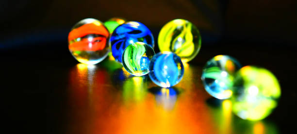 istock Colourful small marbles isolated unique stock photo 1278638405