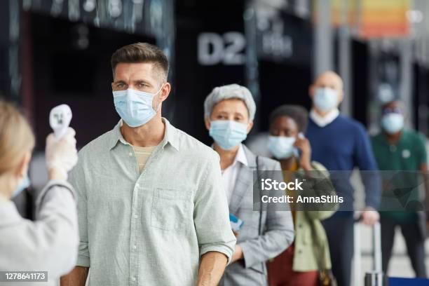 People In Masks During Pandemic Stock Photo - Download Image Now - Protective Face Mask, Airplane, People