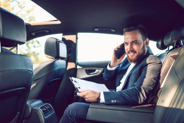 istock Smiling Businessman Preparing For Meeting While Traveling 1278641906