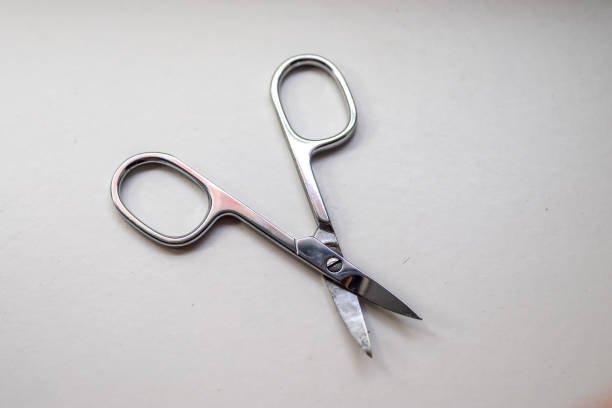 istock manicure scissors closeup on white background. 1278643234