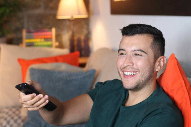 istock Young ethnic man watching tv 1278645037