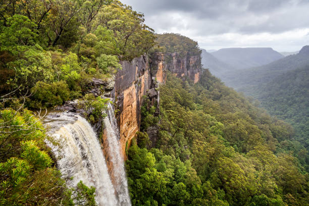 istock Fitzroy water falls thundering over rock face into forested canyon in Kangaroo Valley, NSW, Australia 1278645038