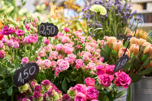 istock Vases with different colored flowers, showcase flower shop. Beautiful spring bouquets. . Small family business. Work florist. copy space 1278647843