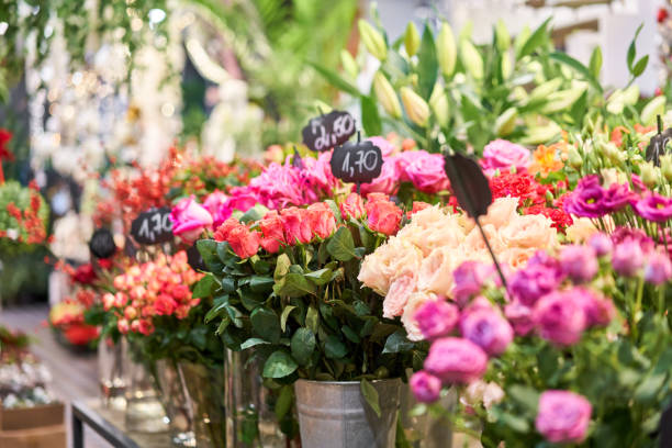istock Vases with different colored flowers, showcase flower shop. Beautiful spring bouquets. . Small family business. Work florist. copy space 1278647969