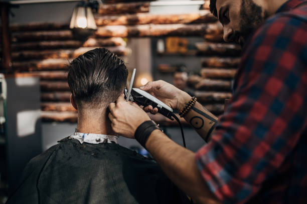 istock One hairstylist serving client at barber shop 1278651509
