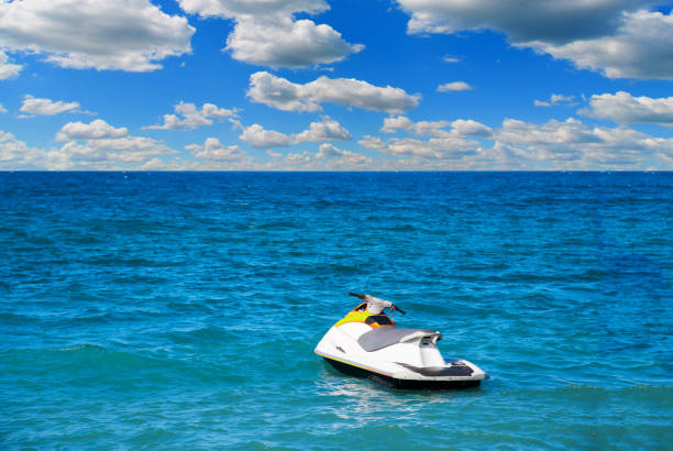 istock Jetski floating on sea water with cloudy sky 1278652206