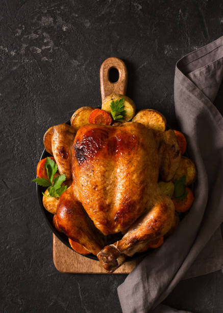 istock Fall thanksgiving table with roasting chicken or turkey food on black background 1278655441