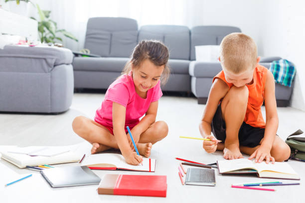 istock Covid-19 Coronavirus and Learning from home, Home school kid concept. Little children study online learning from home with laptop. Quarantine and Social distancing concept. 1278656972
