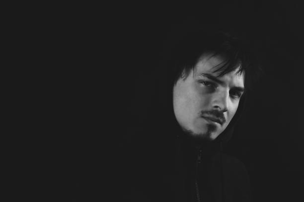 istock Young man in the dark. male portrait 1278657338