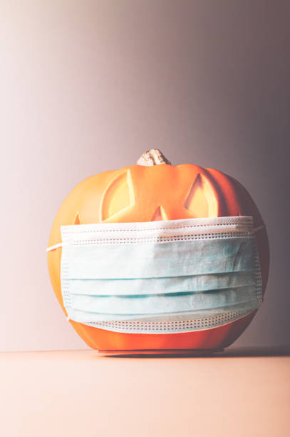 istock Halloween Jack o Lantern in medical mask 1278659942