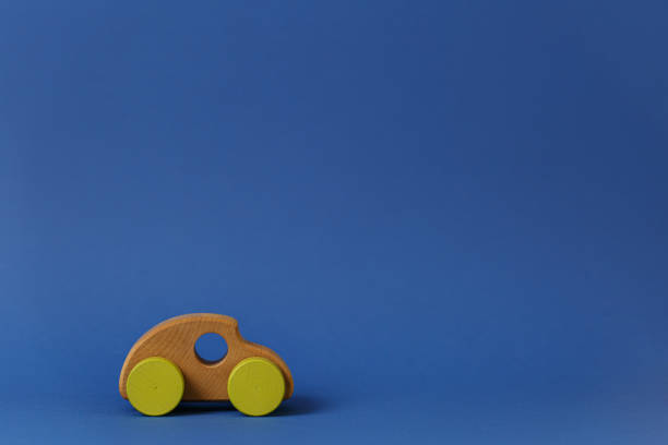 istock Wooden car on a blue background. 1278662848