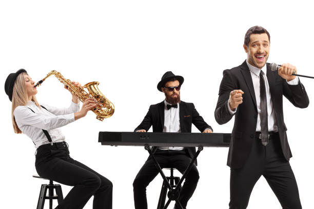 istock Sax, keyboard and a male singer with a microphone 1278665987