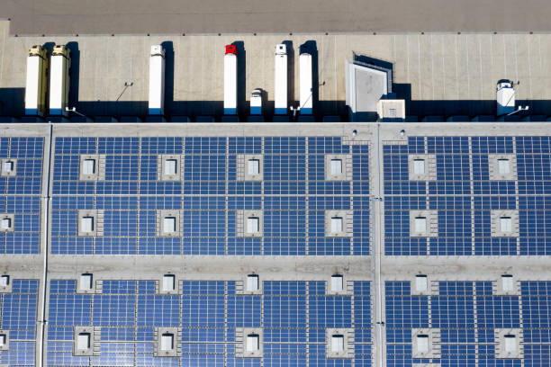 istock Aerial View of Trucks Loading at Logistic Center, Distribution Warehouse with Solar Photovoltaic Panels 1278667738