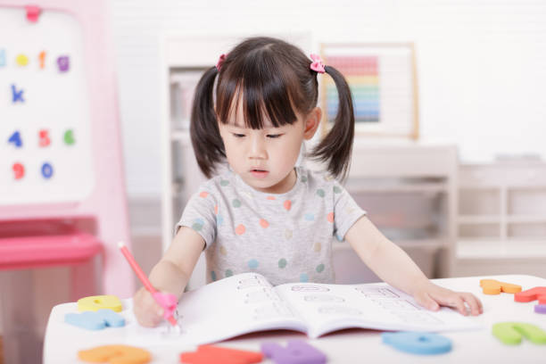 istock young girl practice writing letters for home schooling 1278668536