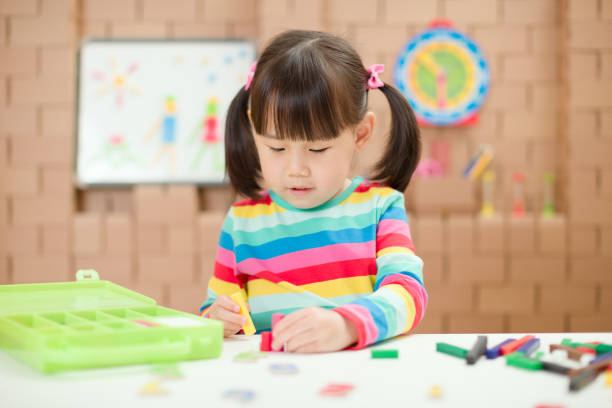 istock young girl play number blocks for home schooling 1278668683