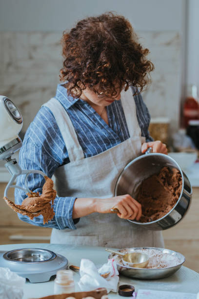 istock Making Cookie Dough: a Woman Mixing Ingredients in a Mixing Bowl 1278671155
