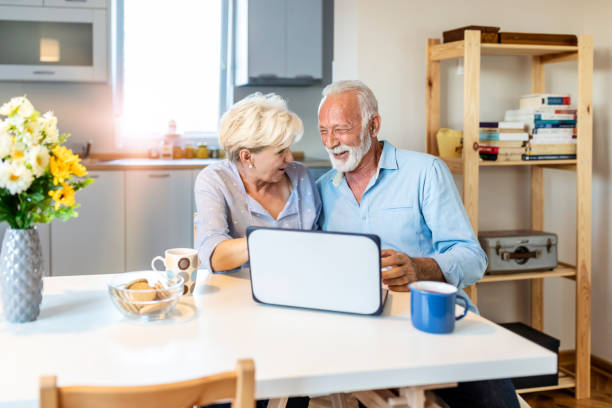 istock Senior couple doing a video call at home 1278671471