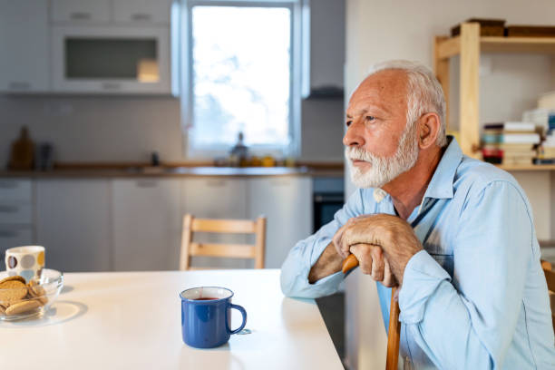 istock Elderly man sitting alone at home 1278671669