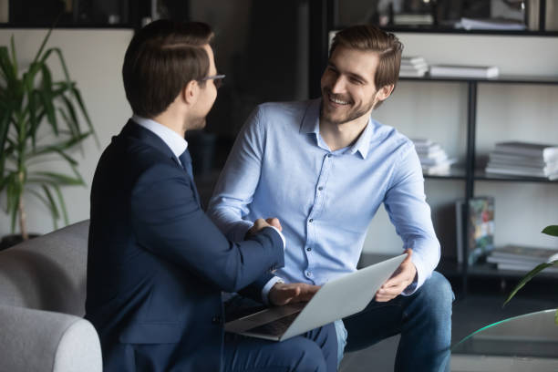 istock Smiling young employee shaking hands with pleasant ceo executive manager. 1278673133