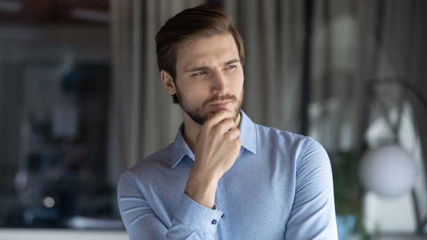 istock Young pensive businessman thinking of professional challenges. 1278673162