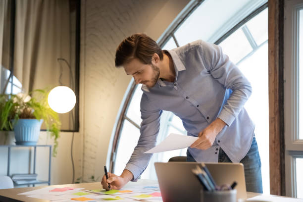 istock Serious skilled male employee involved in workflow management activity. 1278673223