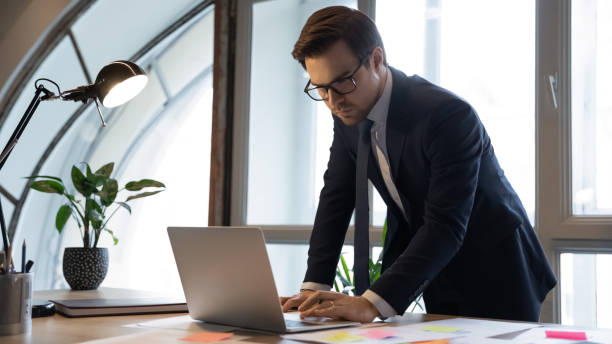 istock Focused 30s male ceo preparing computer presentation. 1278673226