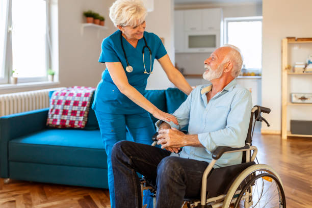 istock Health care worker helping an elderly patient 1278674178