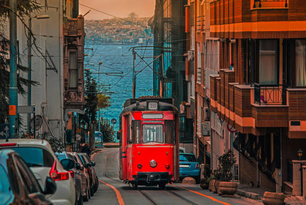 Old tram going through the streets of Kadikoy on the Asian side of Istanbul Old nostalgic tram going through the streets of Kadikoy district on the Asian side of Istanbul. The trendy neighborhood is full of colorful buildings. Marmara Sea. kadikoy stock pictures, royalty-free photos & images