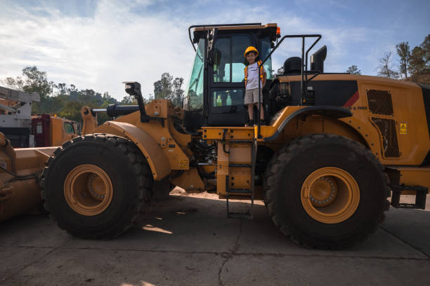istock Boy in a construction uniform and setting working at the site 1278678960